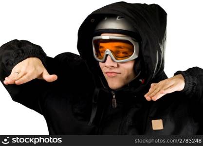 Teenager boy with orange goggles and black suit with hood and helmet acting like he&acute;s snowboarding. Studio shot.