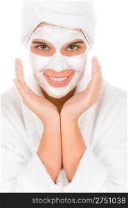 Teenager facial mask - happy woman on white background