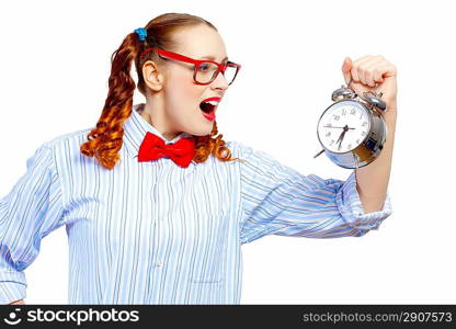 Teenager girl holding alarm clock