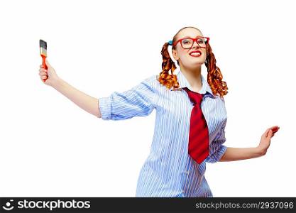 Teenager girl holding paintbrush