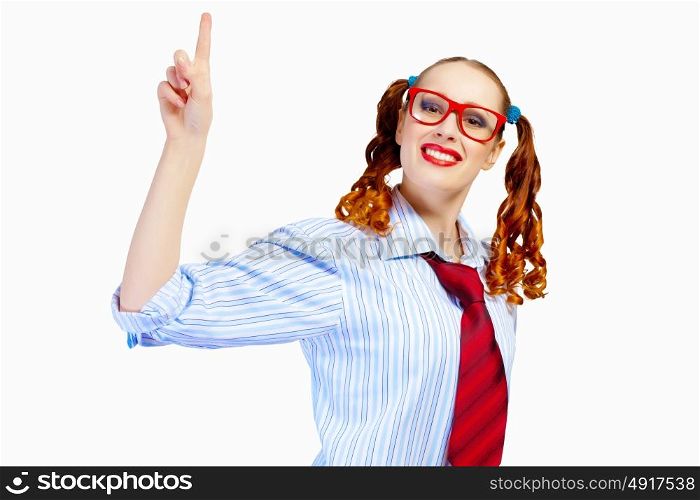 Teenager girl in red glasses. Image of pretty teenager girl in red glasses pointing with finger