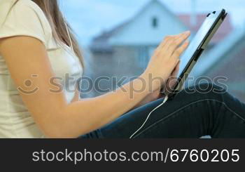 Teenager Girl Listening Music On Digital Tablet