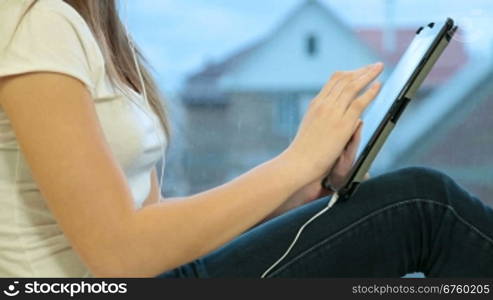 Teenager Girl Listening Music On Digital Tablet