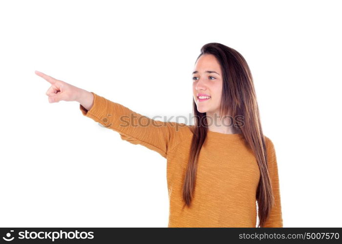 Teenager girl of sixteen years old indicating something isolated on a white background