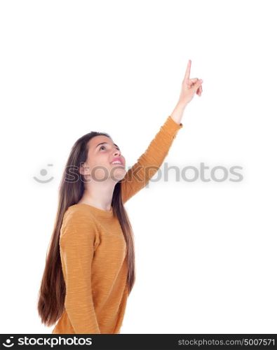Teenager girl of sixteen years old indicating something isolated on a white background