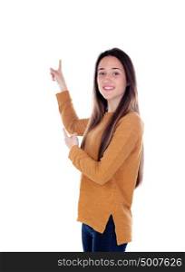Teenager girl of sixteen years old indicating something isolated on a white background