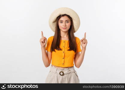 Teenager girl on summer vacation surprised and pointing finger on copy space over isolated white background. Teenager girl on summer vacation surprised and pointing finger on copy space over isolated white background.