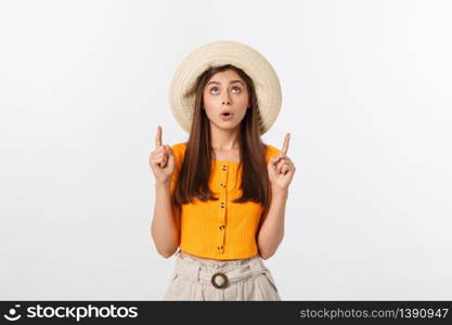 Teenager girl on summer vacation surprised and pointing finger on copy space over isolated white background. Teenager girl on summer vacation surprised and pointing finger on copy space over isolated white background.