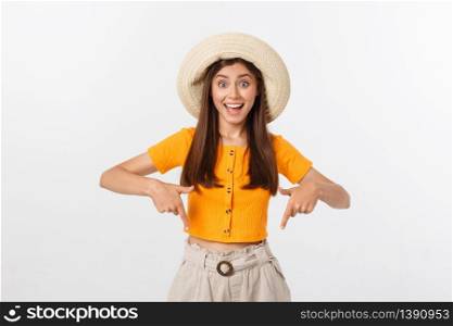 Teenager girl on summer vacation surprised and pointing finger on copy space over isolated white background. Teenager girl on summer vacation surprised and pointing finger on copy space over isolated white background.