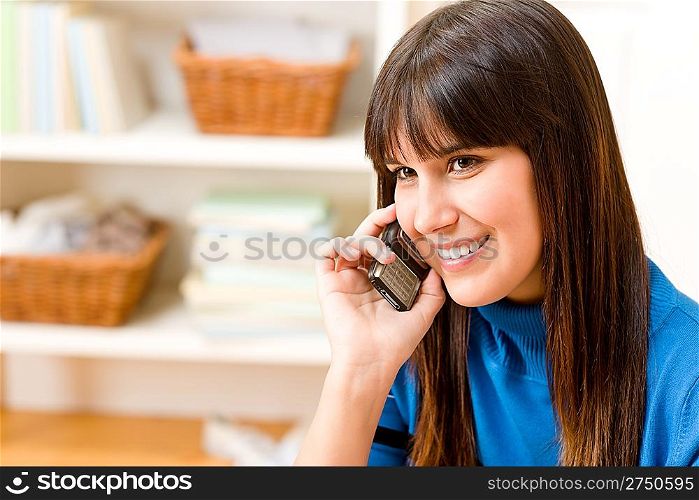 Teenager girl relax home - happy on phone