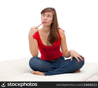 teenager girl sitting on the sofa and looking thoughtfully top isolated