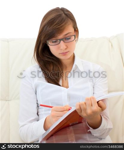 teenager girl sitting on the sofa and read