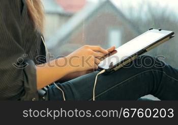 Teenager Girl Using Digital Tablet, Listening Music