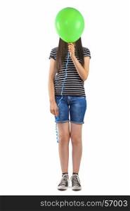 Teenager girl with balloon cover her face on white background.