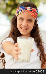 Teenager girl with blue eyes and a milk glass