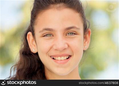 Teenager girl with blue eyes smiling outdoor