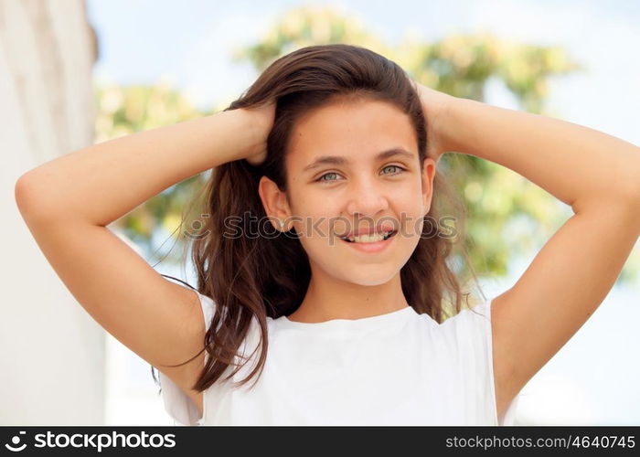 Teenager girl with blue eyes smiling outdoor