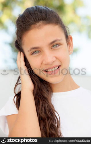 Teenager girl with blue eyes smiling outdoor