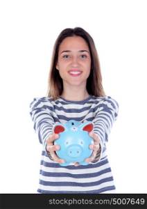 Teenager girl with blue piggy bank isolated on a white background