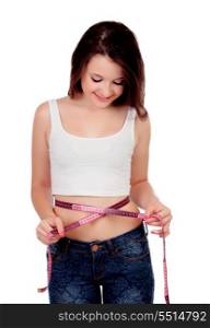 Teenager girl with tape measure isolated on a white background