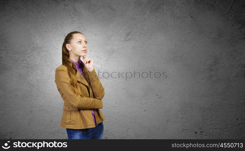 Teenager girl. Young pretty woman in casual looking upwards