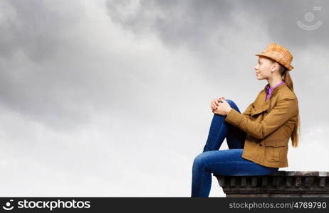 Teenager girl. Young pretty woman in casual looking upwards