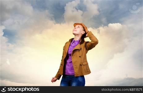 Teenager girl. Young pretty woman in casual looking upwards
