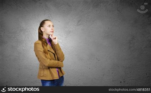 Teenager girl. Young pretty woman in casual looking upwards
