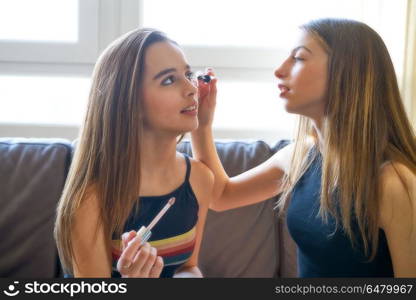 Teenager girls best friends makeup each other. Teenager girls best friends makeup each other make-up