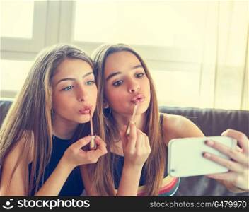 Teenager girls best friends makeup selfie camera. Teenager girls best friends makeup selfie camera in smartphone make-up