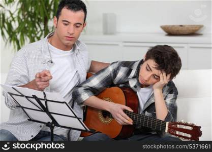 teenager having music lesson