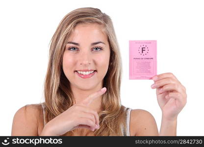 Teenager holding to driving license