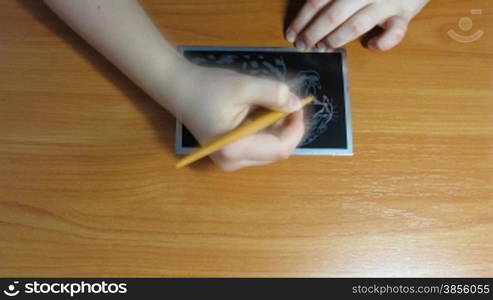 teenager is engraving. time lapse.