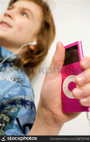 Teenager listening to Mp3 player