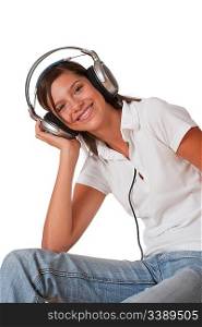 Teenager listening to music with headphones on white background