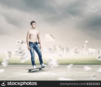 Teenager on skateboard. Skater in jeans riding on road against city background