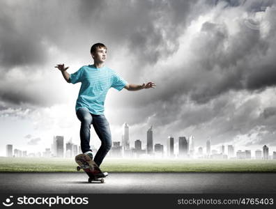 Teenager on skateboard. Skater in jeans riding on road against city background