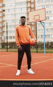 teenager playing basketball outdoors 3