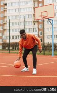 teenager playing basketball outdoors 4