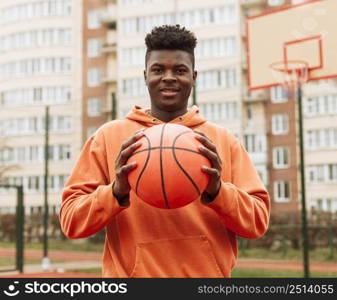 teenager playing basketball outdoors 5