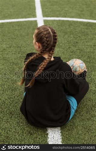 teenager posing with ball outdoors 2