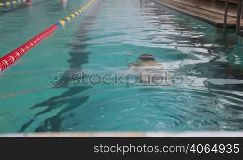 teenager practicing in a swimming pool