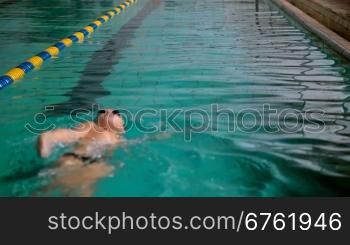 teenager practicing in a swimming pool