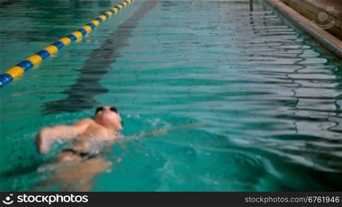 teenager practicing in a swimming pool