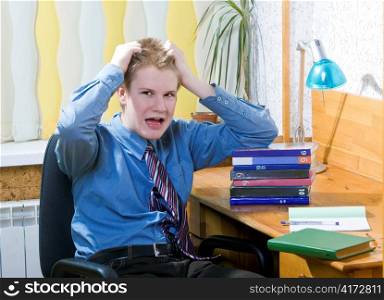Teenager schoolboy was tired from lessons