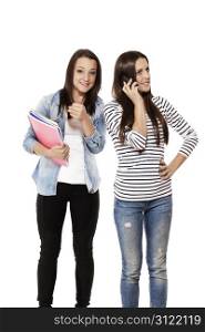teenager showing thumb up while her frind is on the phone. teenage student showing thumb up while her frind is on the phone on white background