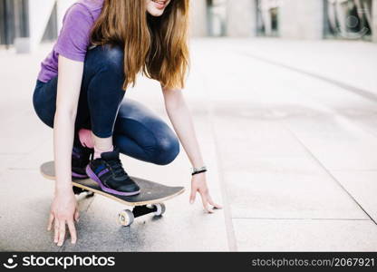 teenager skateboard touching floor