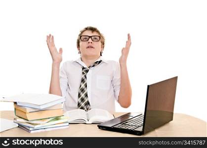 teenager student sits behind a desk isolated on white background