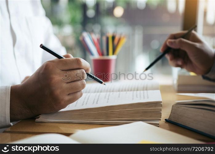 Teenager studying at desk and doing homeworks