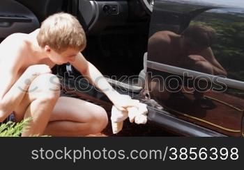 teenager washing the car